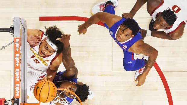 Iowa State University Cyclones forward Robert Jones (12) lays up the ball around Kansas Jayhawks forward KJ Adams Jr. (24) during the second half at Hilton Coliseum Saturday, Feb. 4, 2023, in Ames, Iowa. Kansas And Iowa State Men S Basketball