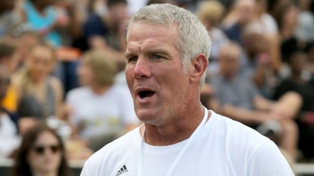 Former quarterback Brett Favre looks on before a Southern Mississippi football game.
