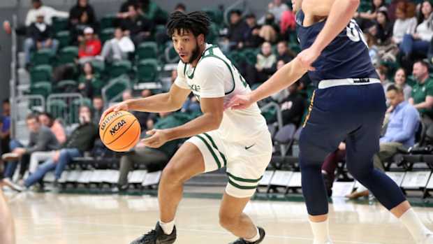 Portland State’s Isaiah Johnson drives against NAU.