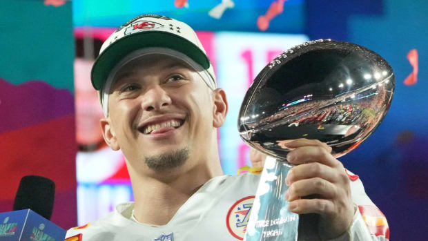Chiefs quarterback Patrick Mahomes holds the Lombardi Trophy after the team won Super Bowl LVII.
