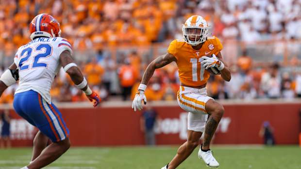 Sep 24, 2022; Knoxville, Tennessee, USA; Tennessee Volunteers wide receiver Jalin Hyatt (11) runs the ball against Florida Gators safety Rashad Torrence II (22) during the second half at Neyland Stadium. Mandatory Credit: Randy Sartin-USA TODAY Sports