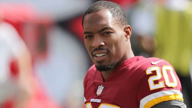 Washington safety Ha Ha Clinton-Dix looks on without a helmet before a game.