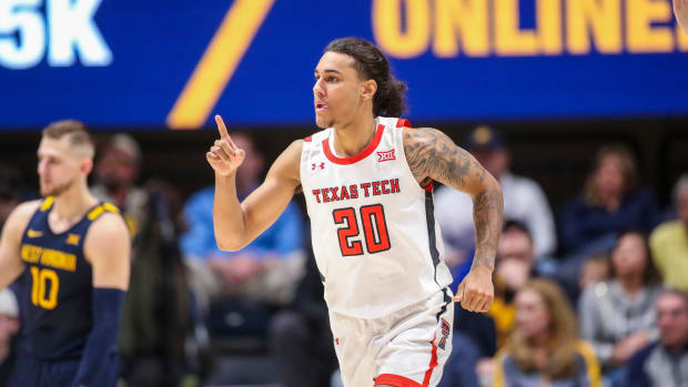 Feb 18, 2023; Morgantown, West Virginia, USA; Texas Tech Red Raiders guard Jaylon Tyson (20) celebrates after a three point basket during the second half against the West Virginia Mountaineers at WVU Coliseum. Mandatory Credit: Ben Queen-USA TODAY Sports