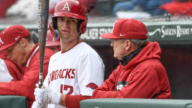 Arkansas Razorbacks coach Dave Van Horn talking with Tavian Josenberger against Eastern Illinois