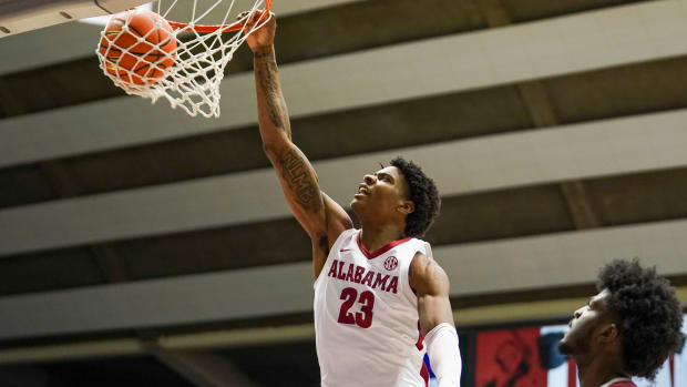 Alabama Crimson Tide forward Nick Pringle (23) dunks the ball against the Arkansas Razorbacks during the second half at Coleman Coliseum.