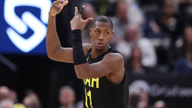 Utah Jazz guard Kris Dunn (11) reacts after making a three point shot against the San Antonio Spurs in the second quarter at Vivint Arena.