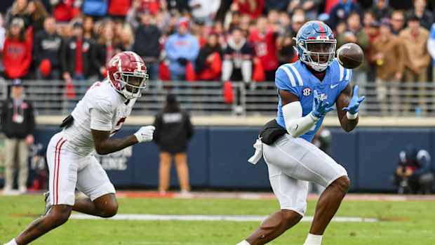 Nov 12, 2022; Oxford, Mississippi, USA; Ole Miss wide receiver Jonathan Mingo (1) catches a pass with Alabama defensive back DeMarcco Hellams (2) covering at Vaught-Hemingway Stadium. Mandatory Credit: Gary Cosby Jr.-USA TODAY Sports
