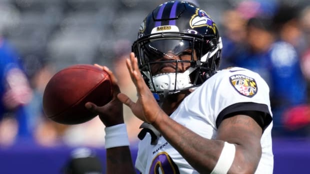 Ravens quarterback Lamar Jackson throws a pass in warmups before a game.