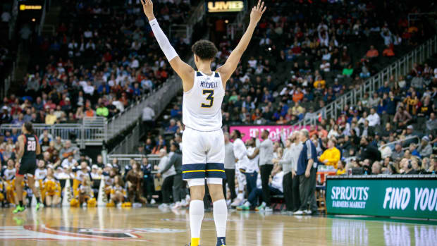 Mar 8, 2023; Kansas City, MO, USA; West Virginia Mountaineers forward Tre Mitchell (3) reacts after a play during the second half against the Texas Tech Red Raiders at T-Mobile Center. Mandatory Credit: William Purnell-USA TODAY Sports