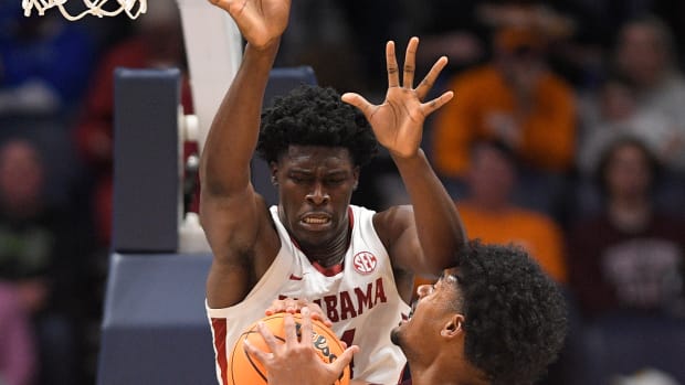 Alabama Crimson Tide center Charles Bediako (14) blocks the shot of Mississippi State Bulldogs forward Tolu Smith (1) during the second half at Bridgestone Arena.