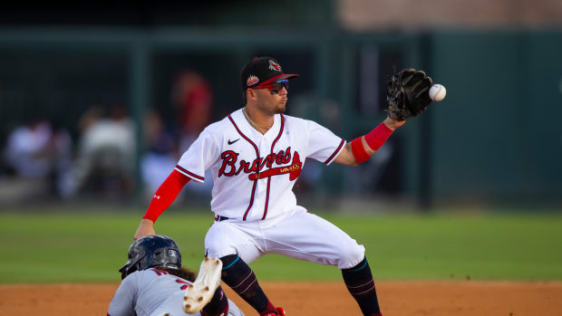 Oct 22, 2022; Phoenix, Arizona, USA; Minnesota Twins infielder Austin Martin dives into second against Atlanta Braves infielder Cal Conley during an Arizona Fall League baseball game at Phoenix Municipal Stadium. Mandatory Credit: Mark J. Rebilas-USA TODAY Sports