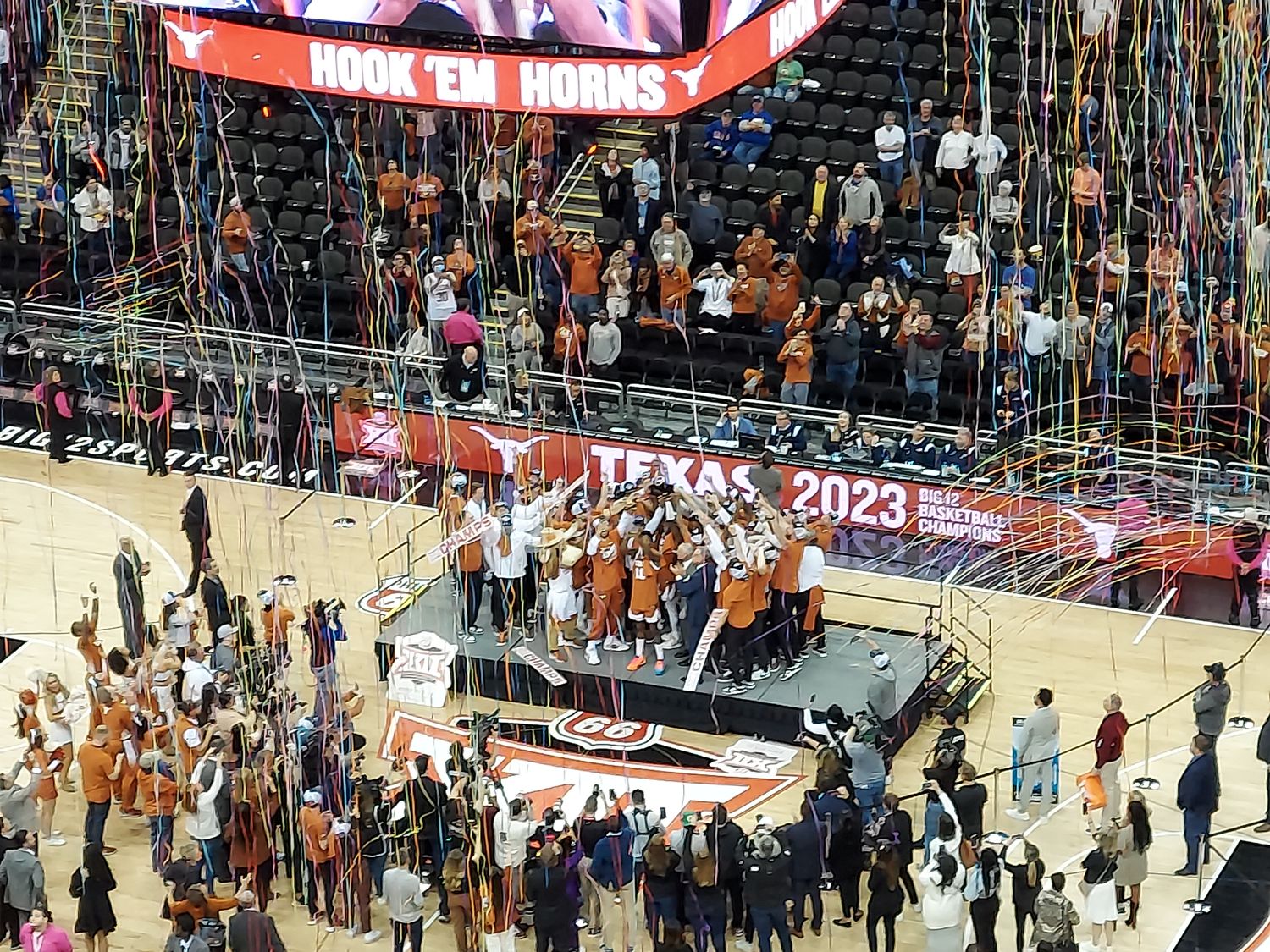 The Texas Longhorns celebrate winning the Phillips 66 Big 12 Championship at T-Mobile Center in Kansas City.