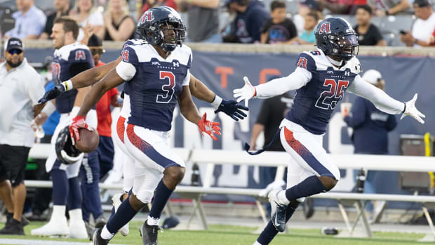 Houston Roughnecks defensive back Ajene Harris (3) celebrates his interception against the Arlington Renegades in the first quarter at TDECU Stadium.
