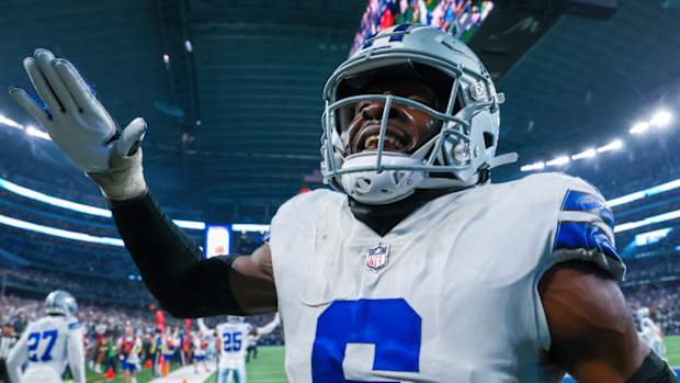 Cowboys safety Donovan Wilson reacts to stopping a play during a game in 2022.