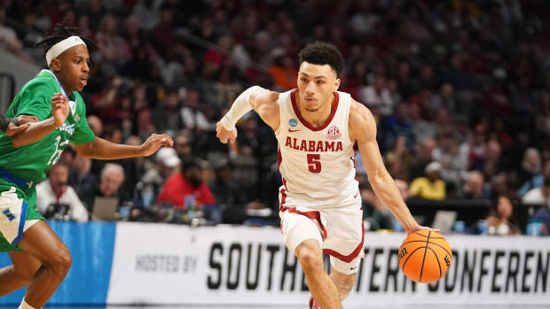 Mar 16, 2023; Birmingham, AL, USA; Alabama Crimson Tide guard Jahvon Quinerly (5) dribbles against Texas A&M-CC Islanders guard Ross Williams (23) during the first half in the first round of the 2023 NCAA Tournament at Legacy Arena. Mandatory Credit: Marvin Gentry-USA TODAY Sports