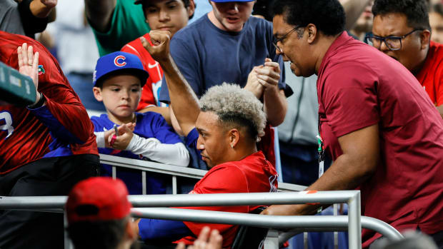 Edwin Diaz is carted off in a wheelchair after suffering an apparent knee injury playing for Puerto Rico in the WBC