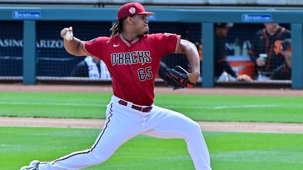 Luis Frias throws a pitch in the second inning against the San Francisco Giants at Salt River Fields