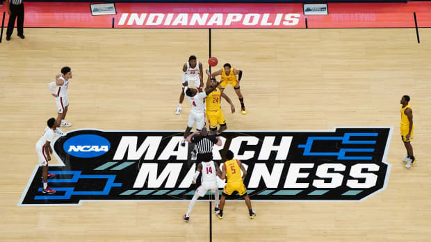 Alabama Crimson Tide forward Juwan Gary (4) and Maryland Terrapins forward Donta Scott (24) jump for the tipoff in the second round of the 2021 NCAA Tournament at Bankers Life Fieldhouse.