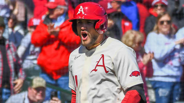 Razorbacks Jared Wegner rounding third heading for home against Auburn on Sunday.