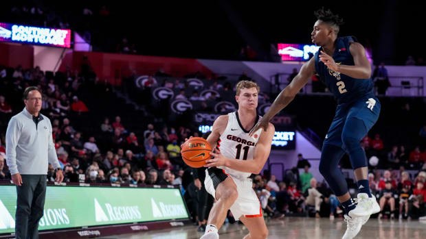 Nov 9, 2021; Athens, Georgia, USA; Georgia Bulldogs head coach Tom Crean looks on as forward Jaxon Etter (11) looks to pass against Florida International Golden Panthers guard Denver Jones (2) during the second half at Stegeman Coliseum. Mandatory Credit: Dale Zanine-USA TODAY Sports