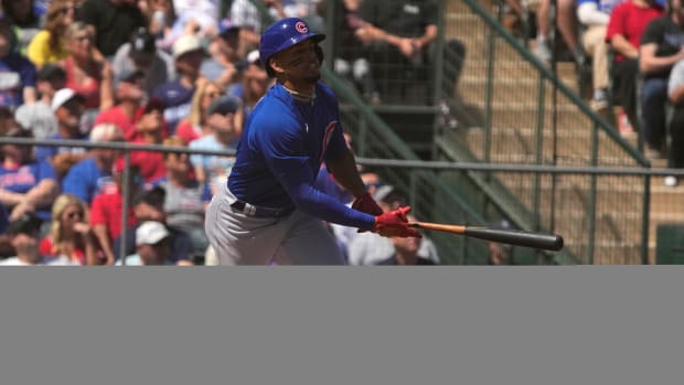 Mar 25, 2023; Tempe, Arizona, USA; Chicago Cubs center fielder Christopher Morel (5) hits a double against the Los Angeles Angels in the second inning at Tempe Diablo Stadium. Mandatory Credit: Rick Scuteri-USA TODAY Sports