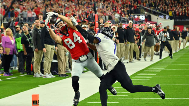 Jan 9, 2023; Inglewood, CA, USA; Georgia Bulldogs wide receiver Ladd McConkey (84) cannot catch a pass against TCU Horned Frogs cornerback Tre'Vius Hodges-Tomlinson (1) during the first half in the CFP national championship game at SoFi Stadium. Mandatory Credit: Jayne Kamin-Oncea-USA TODAY Sports