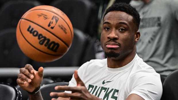 Bucks forward Thanasis Antetokounmpo warms up before a game.