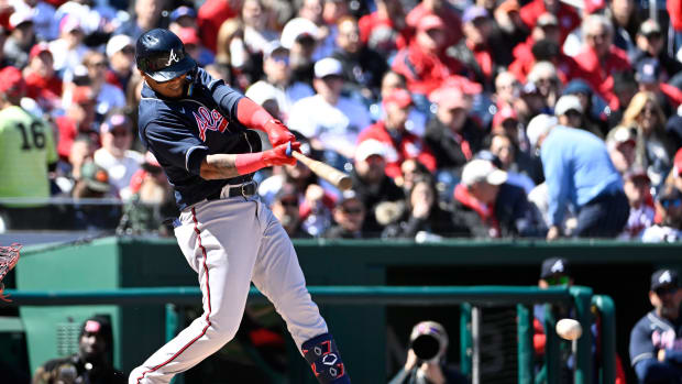 Mar 30, 2023; Washington, District of Columbia, USA; Atlanta Braves second baseman Orlando Arcia (11) hits an RBI single against the Washington Nationals during the second inning at Nationals Park. Mandatory Credit: Brad Mills-USA TODAY Sports