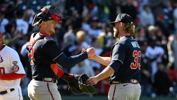 Mar 30, 2023; Washington, District of Columbia, USA; Atlanta Braves relief pitcher A.J. Minter (33) and catcher Sean Murphy (12) celebrate after the game against the Washington Nationals at Nationals Park. Mandatory Credit: Brad Mills-USA TODAY Sports