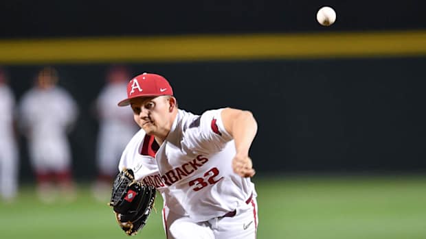 Razorbacks' pitcher Zack Morris warms up before coming into game against Alabama Crimson Tide on Friday night.