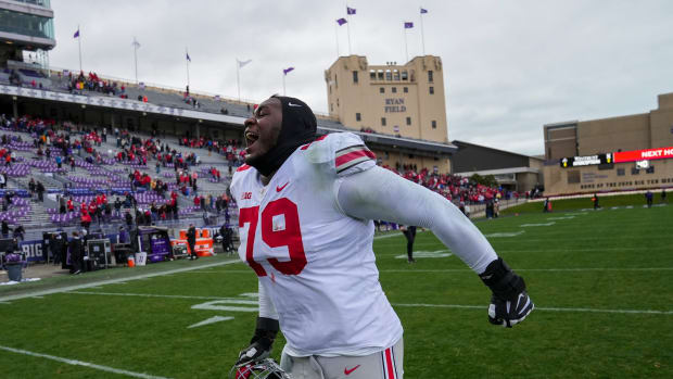 Nov 5, 2022; Evanston, Illinois, USA; Ohio State Buckeyes offensive lineman Dawand Jones (79) celebrates following the NCAA football game against the Northwestern Wildcats at Ryan Field. Ohio State won 21-7. Mandatory Credit: Adam Cairns-The Columbus Dispatch Ncaa Football Ohio State Buckeyes At Northwestern Wildcats