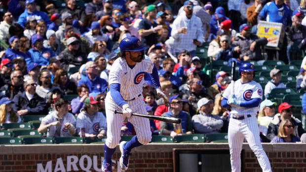 Apr 2, 2023; Chicago, Illinois, USA; Chicago Cubs shortstop Dansby Swanson (7) hits a one run single against the Milwaukee Brewers during the first inning at Wrigley Field. Mandatory Credit: David Banks-USA TODAY Sports