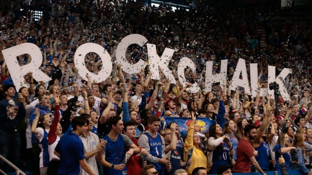 Kansas fans yell out as the starting lineup is announced before the start of Saturday's game against West Virginia inside Allen Fieldhouse.