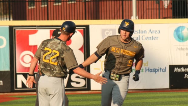 West Virginia sophomore Grant Hussey rounds third after a two-run home run in the top of the second inning.