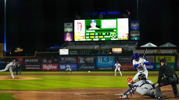 Iowa Cubs first baseman Matt Mervis (41) watches the pitch come towards the plate during the season opener at Principal Park in Des Moines on Friday, March 31, 2023. The Cubs defeated the Clippers, 11-5.