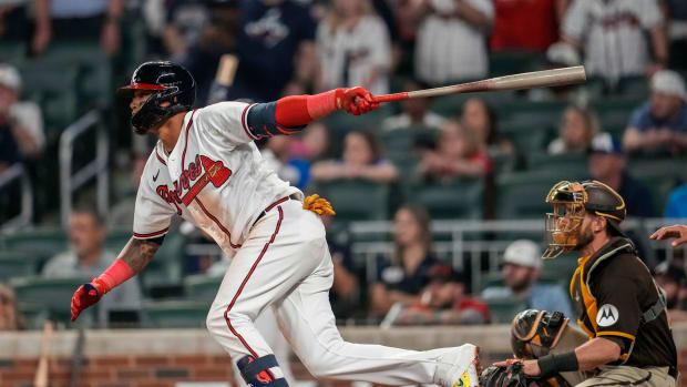 Apr 6, 2023; Cumberland, Georgia, USA; Atlanta Braves shortstop Orlando Arcia (11) drives in the game winning run with a base hit against the San Diego Padres during the ninth inning at Truist Park. Mandatory Credit: Dale Zanine-USA TODAY Sports