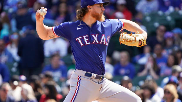 Apr 9, 2023; Chicago, Illinois, USA; Texas Rangers starting pitcher Jon Gray (22) throws the ball against the Chicago Cubs during the first inning at Wrigley Field. Mandatory Credit: David Banks-USA TODAY Sports