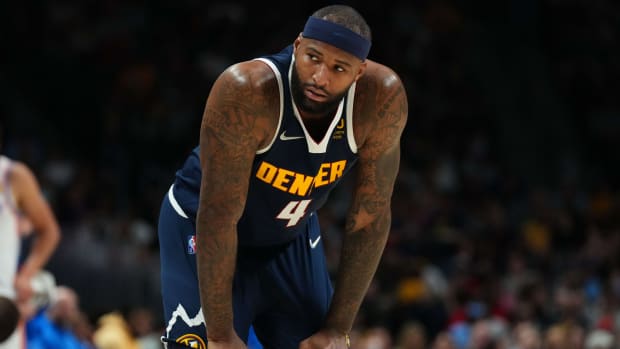 Nuggets center DeMarcus Cousins (4) looks on during the second quarter of a game against the Thunder.