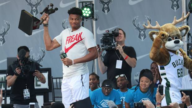 Giannis Antetokounmpo celebrates his MVP award with Bucks fans.