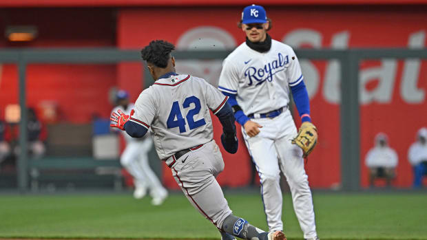 Apr 15, 2023; Kansas City, Missouri, USA; Atlanta Braves second baseman Ozzie Albies (1) rounds second base past Kansas City Royals shortstop Bobby Witt Jr. (7) during the fifth inning at Kauffman Stadium.