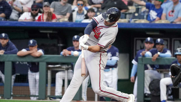 Apr 14, 2023; Kansas City, Missouri, USA; Atlanta Braves first baseman Matt Olson (28) hits a home run against the Kansas City Royals during the first inning at Kauffman Stadium.