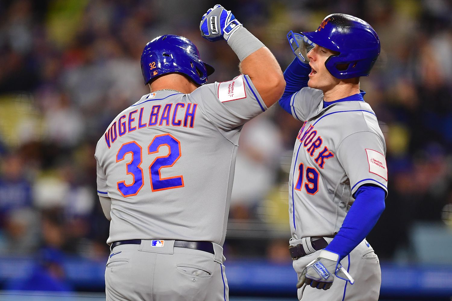 Apr 17, 2023; Los Angeles, California, USA; New York Mets designated hitter Daniel Vogelbach (32) is greeted by left fielder Mark Canha (19) after hitting a two run home run against the Los Angeles Dodgers during the second inning at Dodger Stadium.