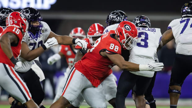 Jan 9, 2023; Inglewood, CA, USA; Georgia Bulldogs defensive lineman Jalen Carter (88) tackles TCU Horned Frogs running back Emari Demercado (3) during the CFP national championship game at SoFi Stadium. Mandatory Credit: Mark J. Rebilas-USA TODAY Sports