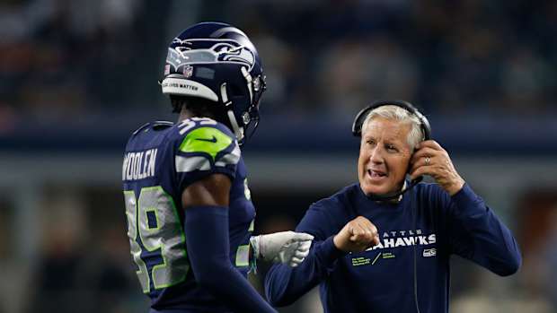 Pete Carroll and Tariq Woolen