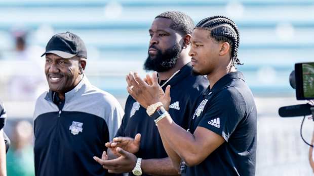 James "Shack" Harris with Terron Armstead and Jameis Winston.