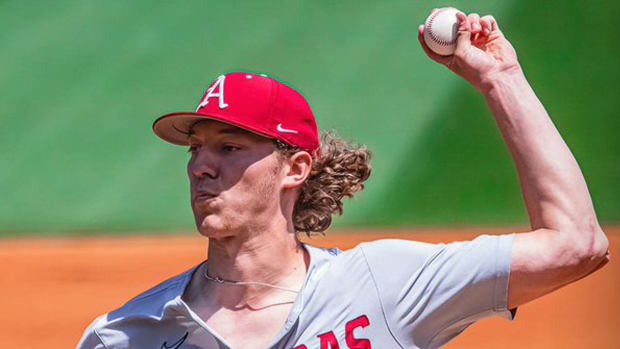 Razorbacks starting pitcher delivers a pitch on the mound against Georgia on Saturday.
