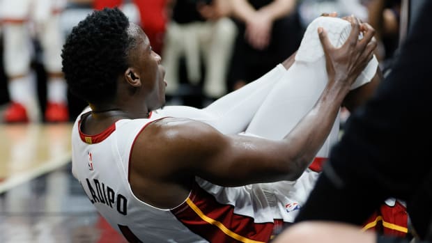 Miami Heat guard Victor Oladipo (4) reacts after getting injured in the fourth quarter