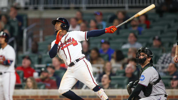 Apr 25, 2023; Atlanta, Georgia, USA; Atlanta Braves second baseman Ozzie Albies (1) hits a home run against the Miami Marlins in eighth inning at Truist Park. Mandatory Credit: Brett Davis-USA TODAY Sports