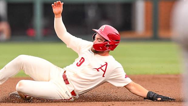 Razorbacks' John Bolton slides into second base during win over Texas A&M on Saturday