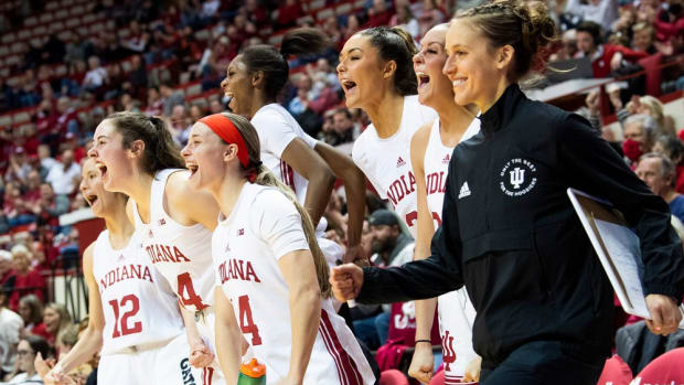 Indiana's Yarden Garzon (12), Mackenzie Holmes (54), Sara Scalia (14), Chloe Moore-McNeil (22), Alyssa Geary (32), Sydney Parrish (33) and Team & Recruitment Coordinator Ali Patberg celebrate a basket by Arielle Wisne (25) during the Indiana versus Morehead State women's basketball game at Simon Skjodt Assembly Hall on Sunday, Dec. 18, 2022.
